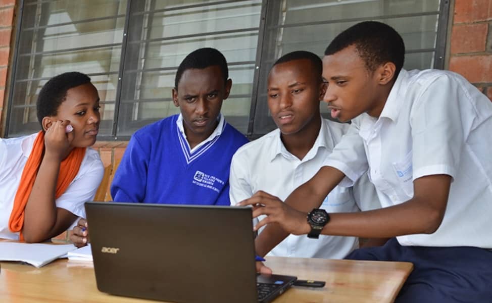 Rwandan students learning digital skills together